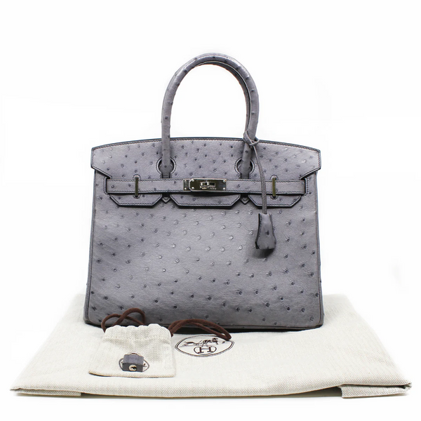 Elegant leather bag with spacious compartments, perfect for work or casual outings.