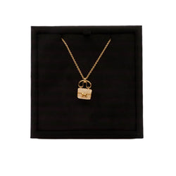 Amulettes Constance pendant rose gold set with diamonds and Kelly snap closure
